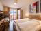 Superior room with double bed and bunk bed | © COOEE alpin Dachstein