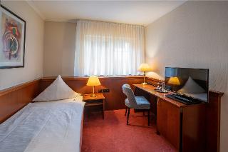 Schreibtisch und TV im Einzelzimmer Standard Hotel Meyerink Vreden